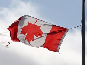 A Canadian flag is held by a lone tether as it blows in a cool breeze in Dartmouth Wednesday February 5, 2025.