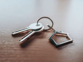 Close-up of Silver house key, Buying and selling houses, Home concept, Selling home, Choosing a house to buy, Home concept, Real estate trading