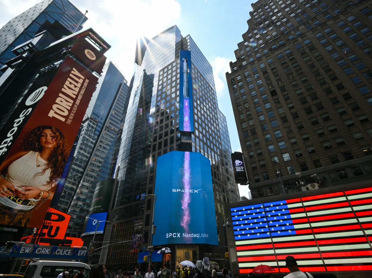 SpaceX advertisements are seen on a digital billboard at the Nasdaq MarketSite in Times Square to celebrate the launch of SpaceX's initial public offering (IPO) in New York on June 12, 2026.