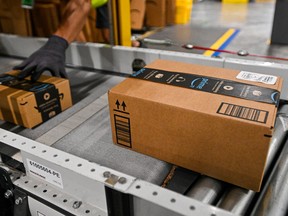 Packages on a conveyor belt during a media tour of the Amazon.com Inc. DAB2 fulfillment center in Daytona Beach, Florida, US, on Tuesday, Sept. 23, 2025.