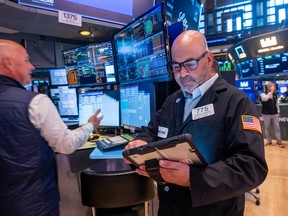 Traders work on the floor of the New York Stock Exchange (NYSE) the day after the Dow fell nearly 1,000 points as the conflict in Iran continues on June 11, 2026 in New York City. Markets were up over 200 points in morning trading.
