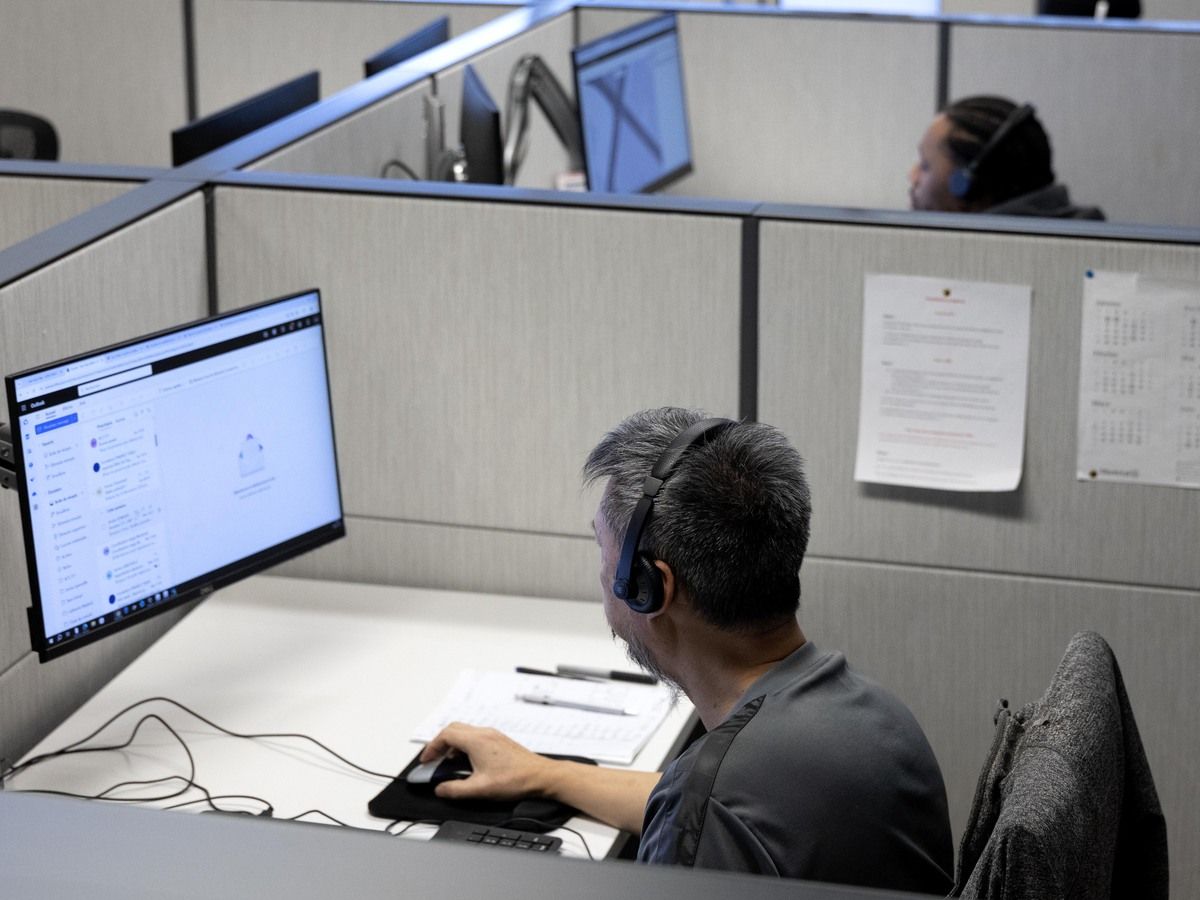 Agents take calls from citizens at the city’s 311 call centre in Montreal, on Friday, December 20, 2024