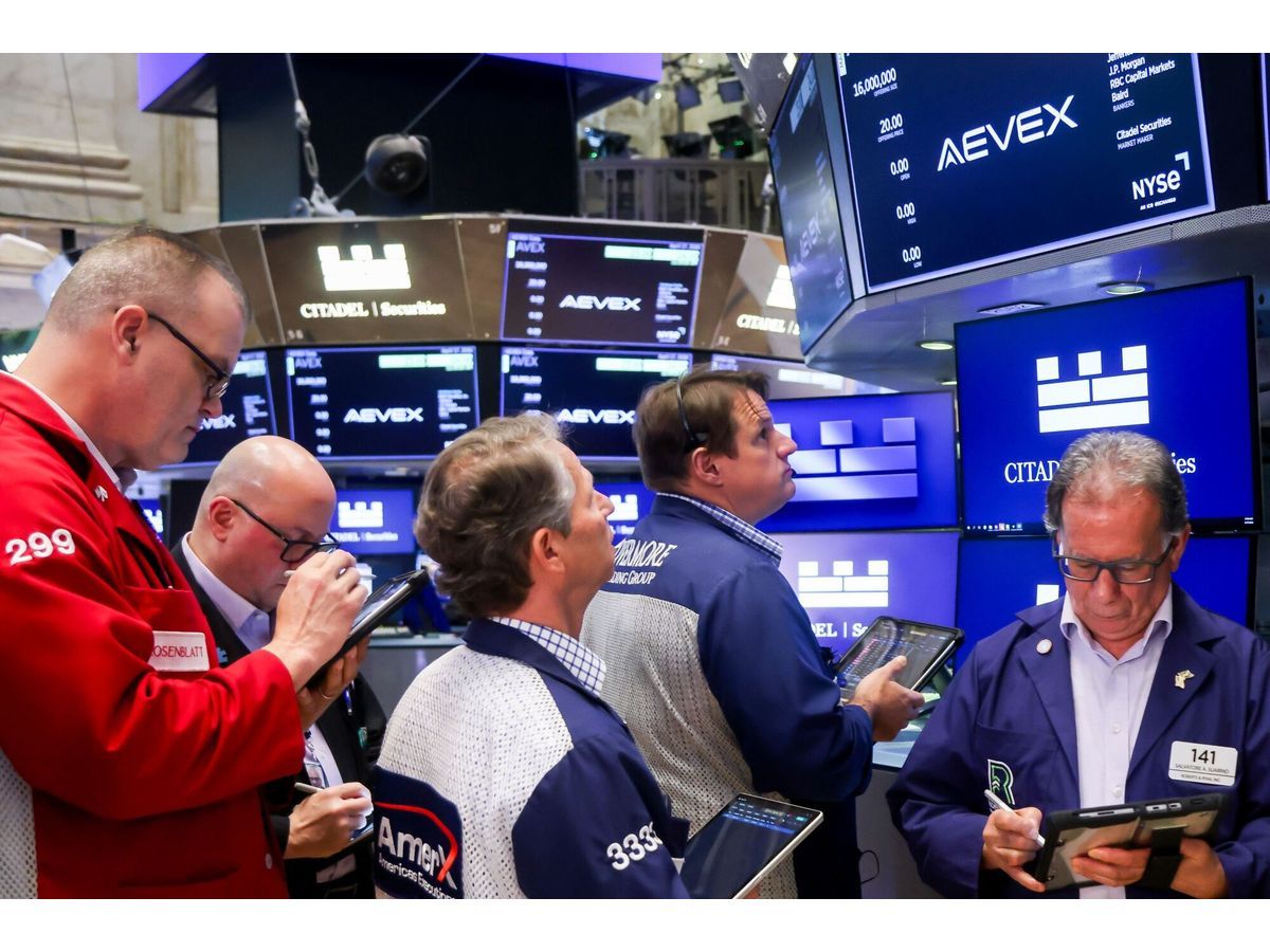 Traders work on the floor of the New York Stock Exchange.