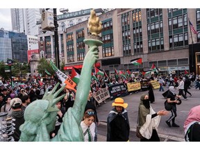 Pro-Palestinian activists march as they take part in a protest on Nakba Day in New York City on May 15.
