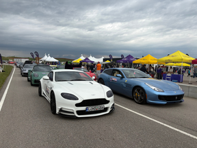 Martin Pelletier's white Aston Martin Vantage (Mansory) is lined up waiting to take kids and their families for a lap at the Rocky Mountain Motorsports track in Calgary during a fundraiser for the Starlight Foundation on June 20.