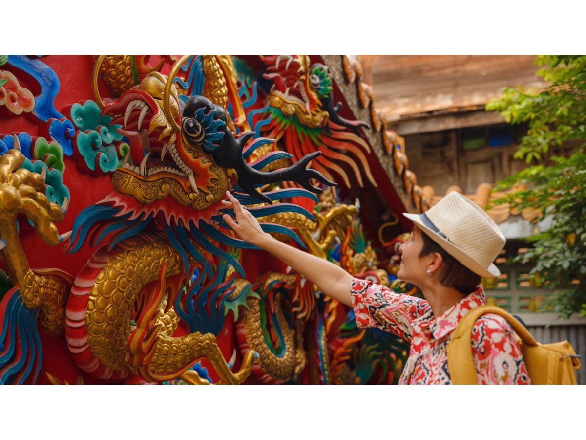 A traveler explores rich cultural heritage in Asia. According to Holafly's Summer Travel Report 2026, destinations like Japan and South Korea are leading a major shift in global travel preferences, attracting tourists seeking diverse and immersive experiences.