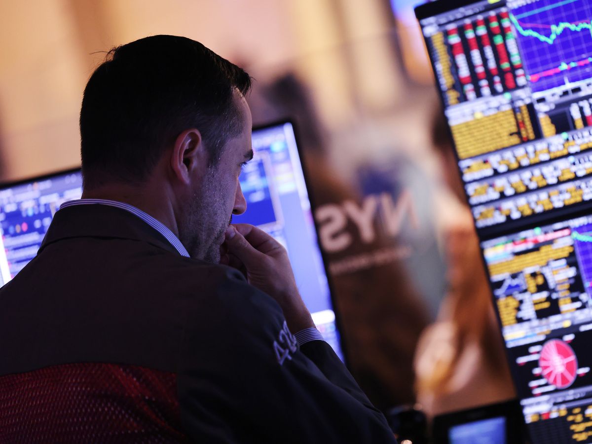 Traders work on the floor of the New York Stock Exchange during afternoon trading in New York City.