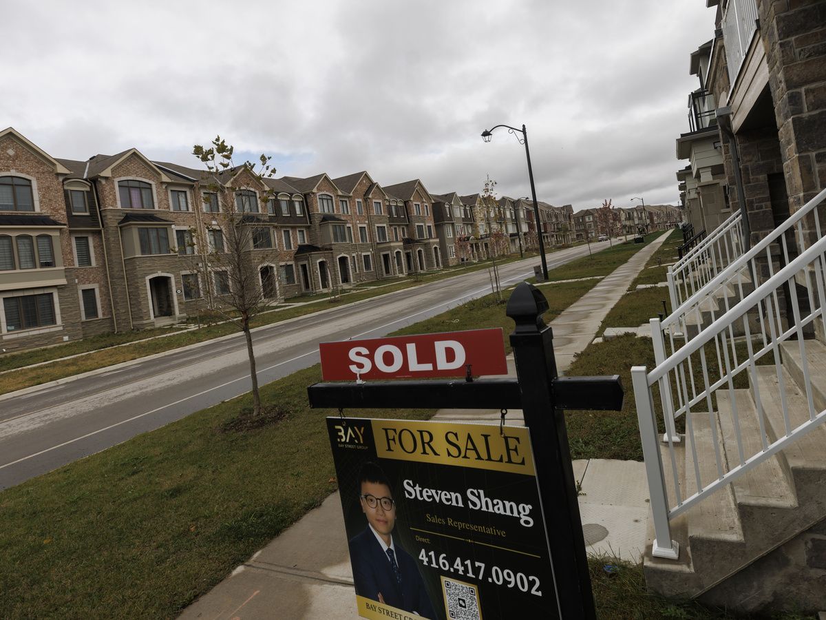 A 'sold' sign in front of newly built homes in Vaughan, Ont.