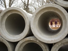 Sewer pipes are stacked before installation under roadways in London, Ont.