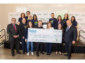 The Honourable Doug Ford, Premier of Ontario and James Maloney, Member of Parliament for Etobicoke-Lakeshore, join Sysco Canada Region President Rodd Olmstead, Jason Welter, Sysco Canada Vice President of Human Resources, Second Harvest CEO Lori Nikkel and Sysco colleagues to present a $50,000 donation to Second Harvest.