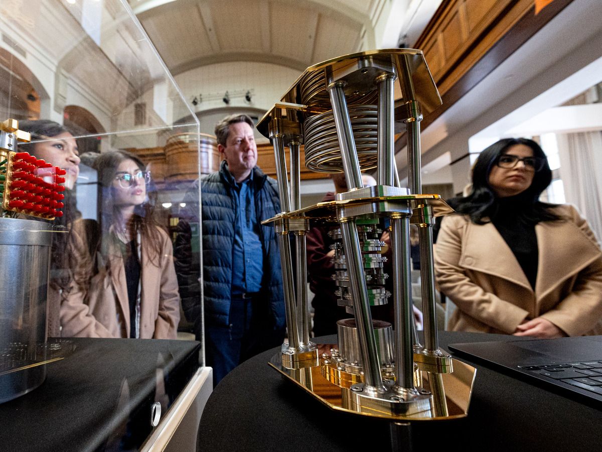 Guests examine quantum technology components during a media announcement highlighting new developments in Canada’s quantum sector at the University of Saskatchewan. Photo taken in Saskatoon, Sask. on Tuesday, March 31, 2026.