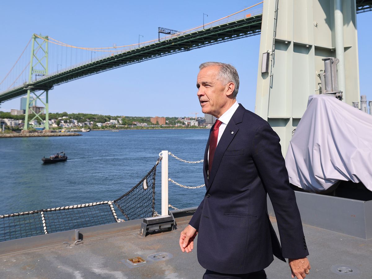 Prime Minister Mark Carney, arrives for a news conference on the flight deck of HMCS Robert Hampton Gray, where he was to make an announcement concerning the submarine procurement for the Royal Canadian Navy at HMC Dockyard in Halifax Monday July 6, 2026.