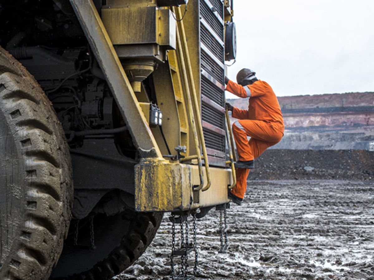 First Quantum Minerals' worker navigates the mud