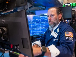 Traders work on the floor of the New York Stock Exchange (NYSE) on July 21, 2026 in New York City.