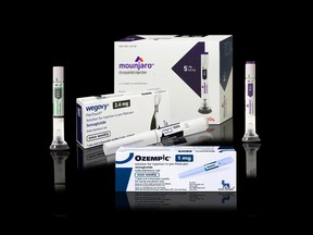 Packaging boxes of Wegovy semaglutide injectable medication with injection pens - weight-loss drug from Novo Nordisk. Isolated on black background with reflections.