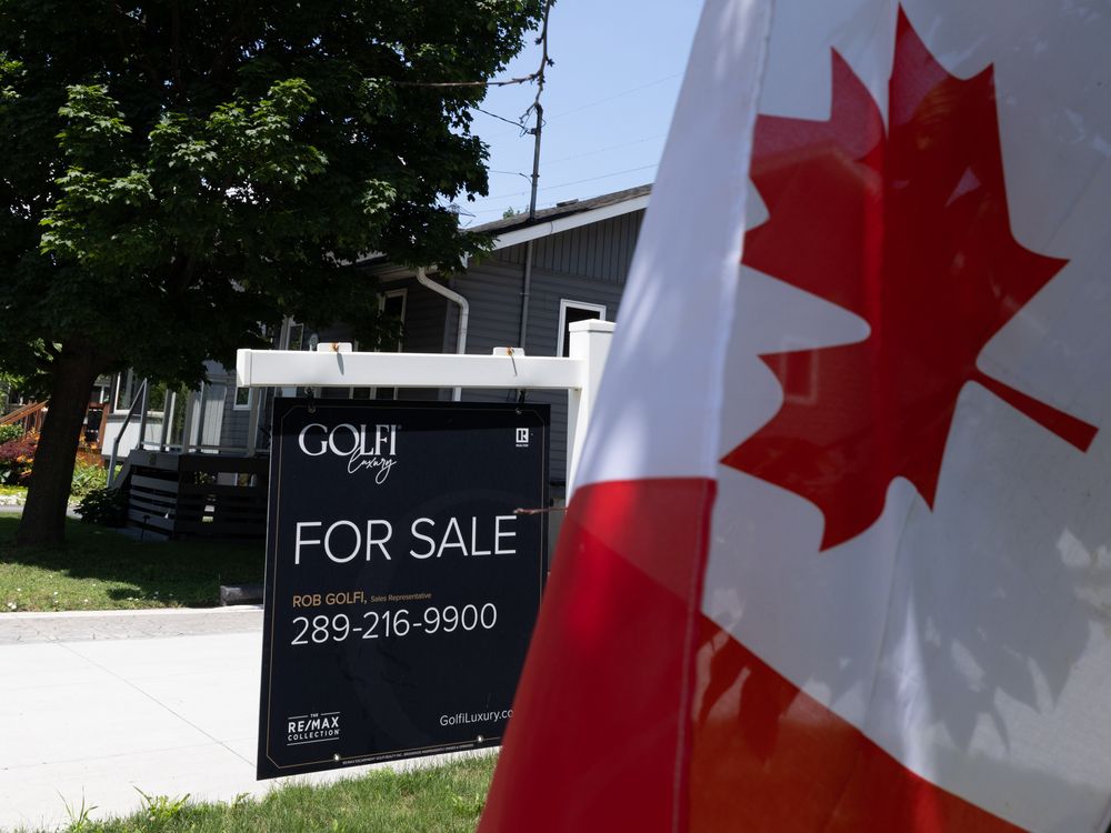 Real estate home for sale signage on Beach Boulevard in Hamilton, Ontario on Wednesday, July 8, 2026.