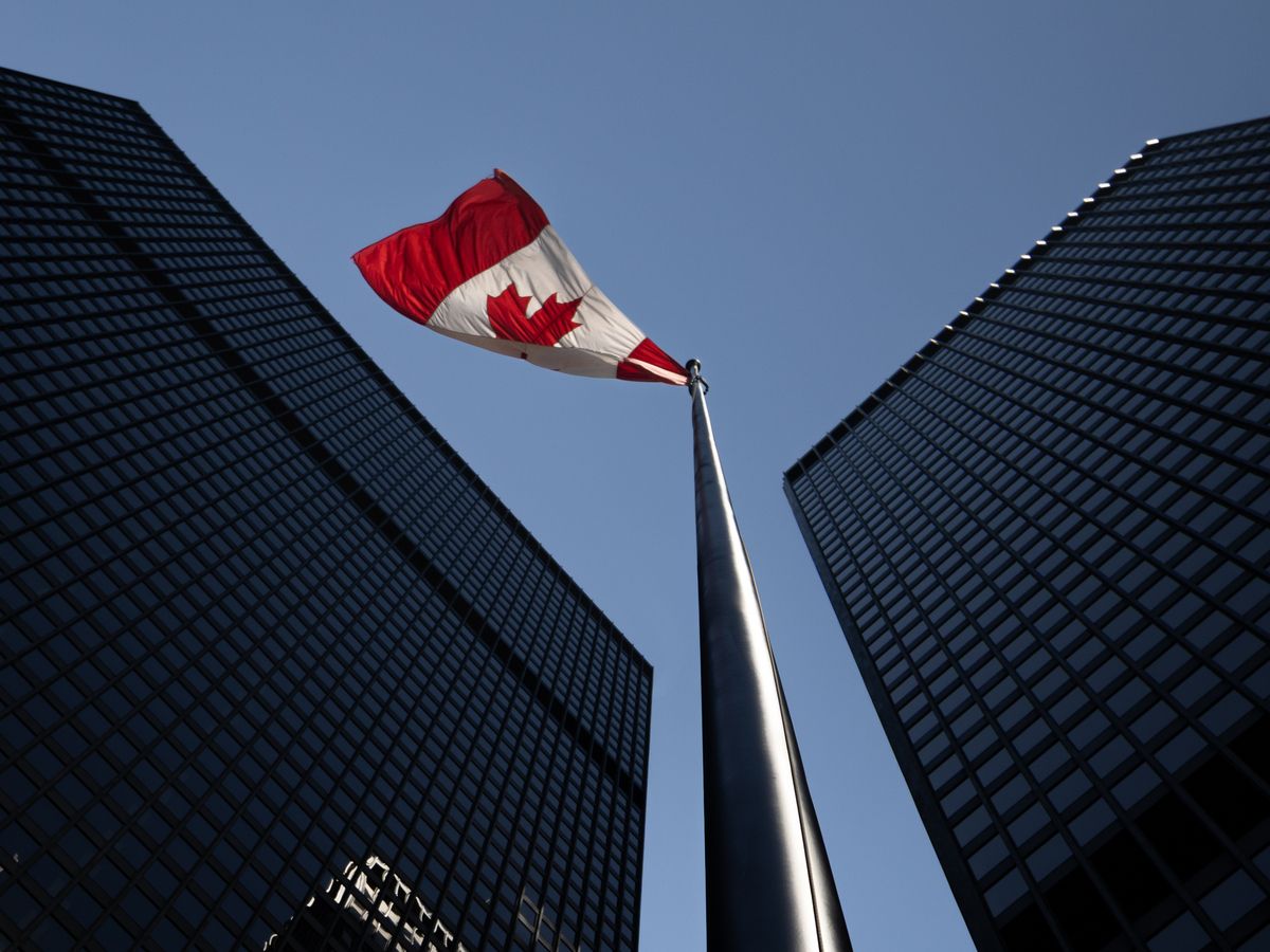 The Canadian flag flying between the TD Centre towers in the financial district in Toronto, Ontario on Tuesday, July 14, 2026.
