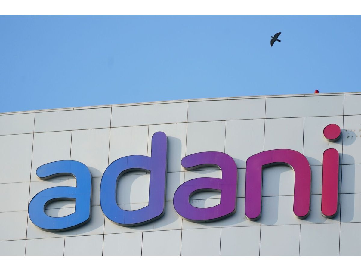 The Adani Group signage atop the company's headquarters in Ahmedabad, India, on Monday, Nov. 3, 2025. Adani Enterprises Ltd. is planning to raise as much as 250 billion rupees ($2.8 billion) through a rights issue as it seeks to invest in capital intensive businesses like its airports venture.
