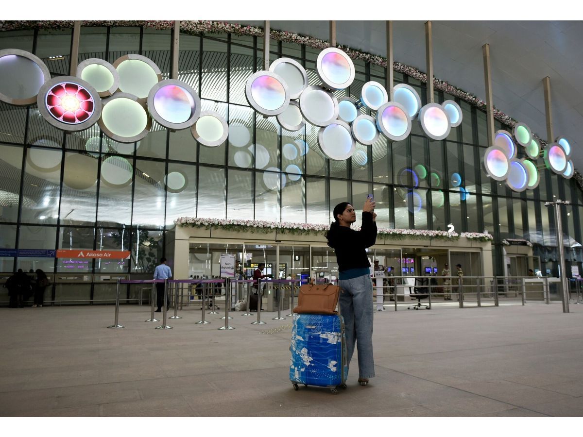 A traveler at Adani Group's Navi Mumbai Airport in Navi Mumbai, India