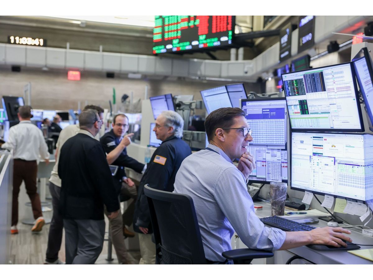 Traders work on the floor of the New York Stock Exchange.