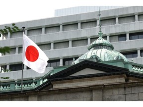 A Japanese flag at the Bank of Japan (BOJ) headquarters in Tokyo, Japan, on Tuesday, June 30, 2026. New BOJ Board Member Ayano Sato said the country's inflation views aren't very strong yet, suggesting her tilt toward accommodative policy as an appointee of Prime Minister Sanae Takaichi.