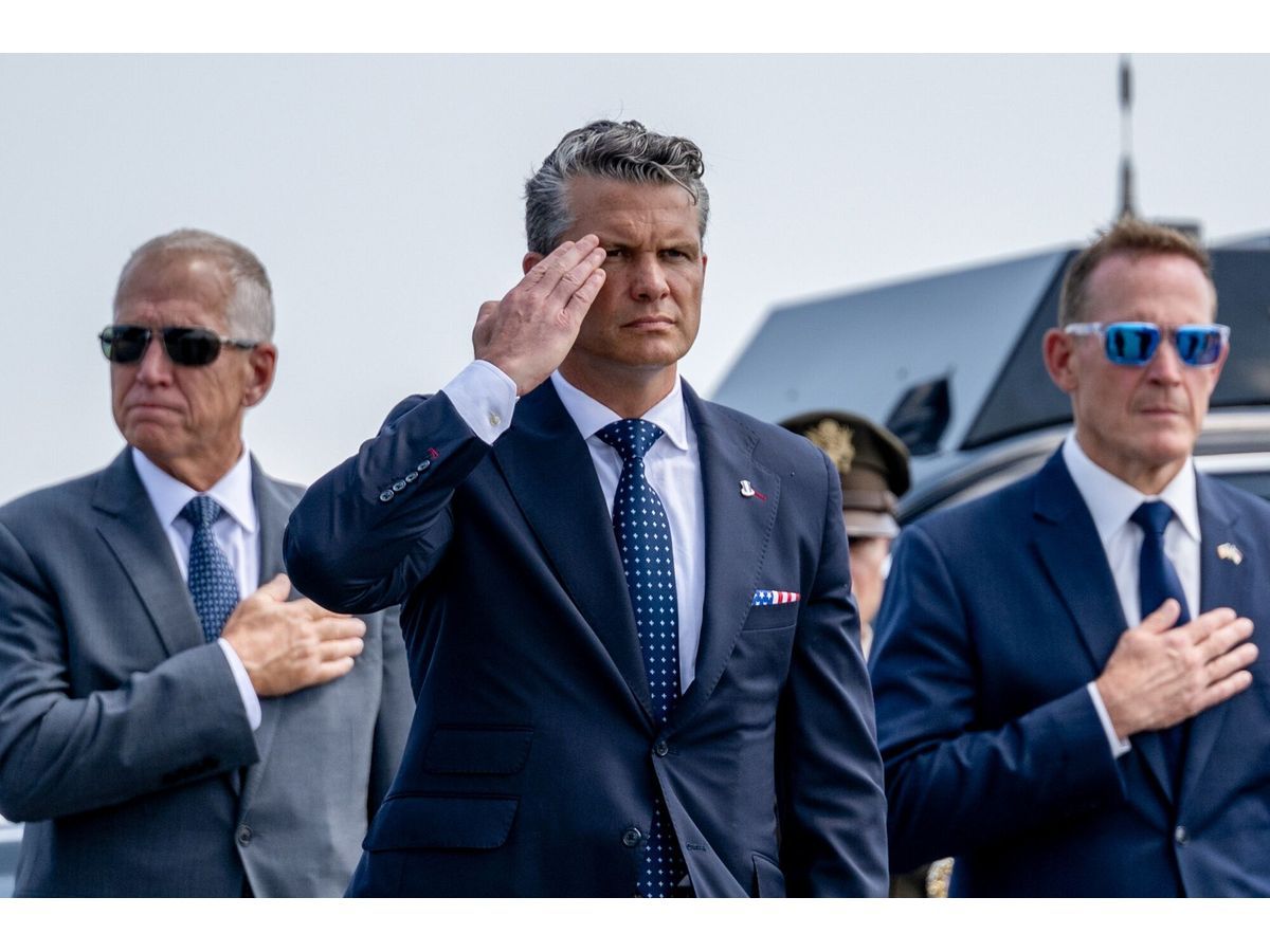 Pete Hegseth, US secretary of defense, salutes during a dignified transfer solemn event at Dover Air Force Base in Dover, Delaware, US, on Wednesday, July 22, 2026.