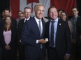 Prime Minister Mark Carney poses with London Mayor Josh Morgan following a press conference at General Dynamics Land Systems in London, Ont. on Thursday, July 16, 2026.