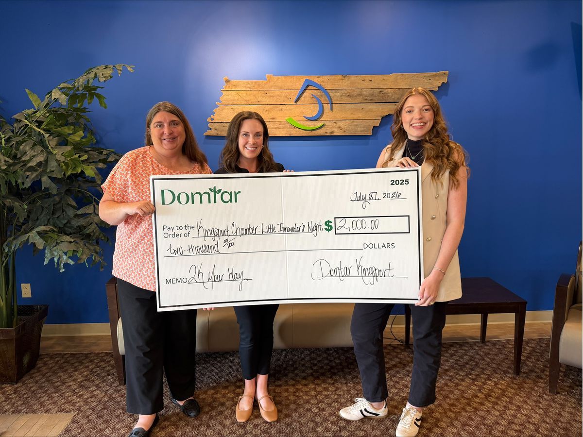 Domtar's Ellie Mitchell (right) presents a $2K Your Way grant to representatives of the Kingsport Chamber's Education & Workforce Development program.