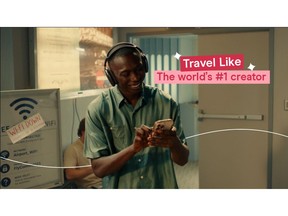 Khaby Lame using a Holafly eSIM to stay connected while travelling through an airport.