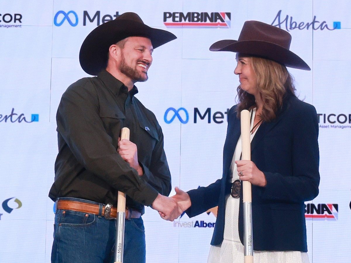 Alberta Premier Danielle Smith shakes hands with Gary Demasi, Meta's vice-president of data centre strategy and development, after the announcement on July 8 that Meta will invest $13 billion building a new data centre in Sturgeon County.
