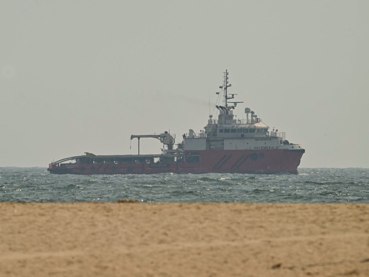 A ship sails off the coast of Ajman on July 10. Traffic through the Strait of Hormuz has fallen sharply since July 8, especially through the UN-backed Omani route, analysts said, after vessels were attacked earlier this week and as the United States and Iran traded renewed strikes.