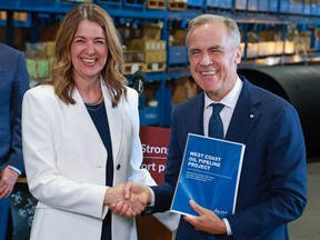 Prime Minister Mark Carney and Alberta Premier Danielle Smith announced the submission of the West Coast pipeline project at TransAm Piping Products in Calgary on July 2.