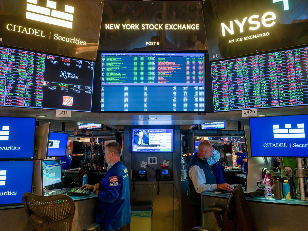 Traders work on the floor of the New York Stock Exchange on July 21, 2026 in New York City.