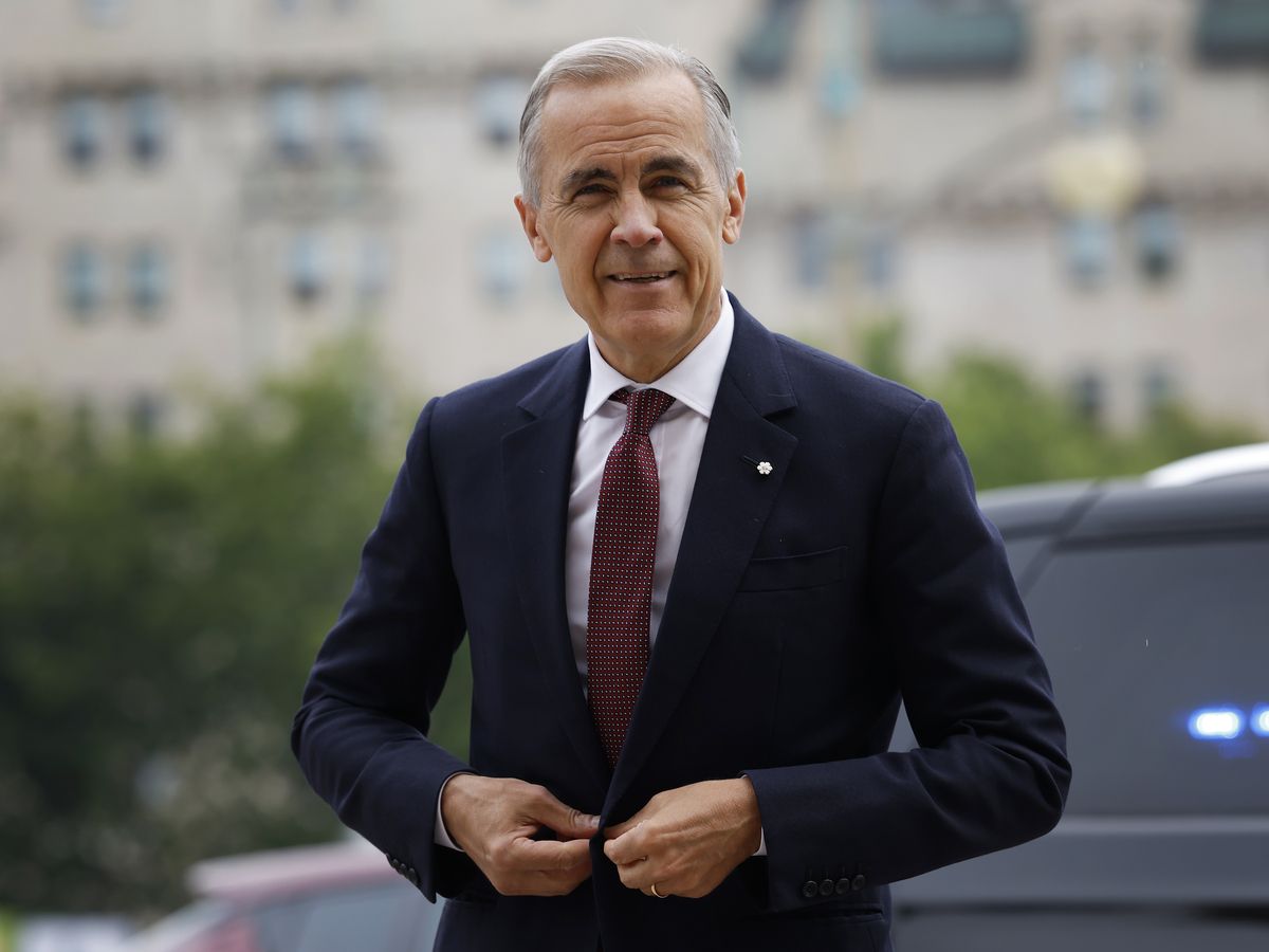 Prime Minister Mark Carney arrives to speak to journalists in the Parliamentary Precinct in Ottawa on July 21, 2026.