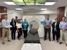 Team members at The Christ Hospital Health Network and Philips pose in front of the latest Philips CT Scanner.