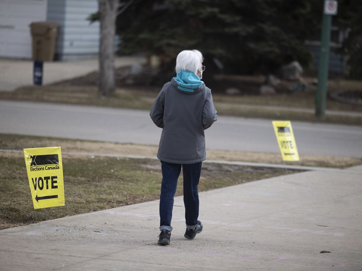 A voter walks away from an advanced polling station located at Campbell Collegiate before the Canadian Federal Election on Monday, April 21, 2025 in Regina.