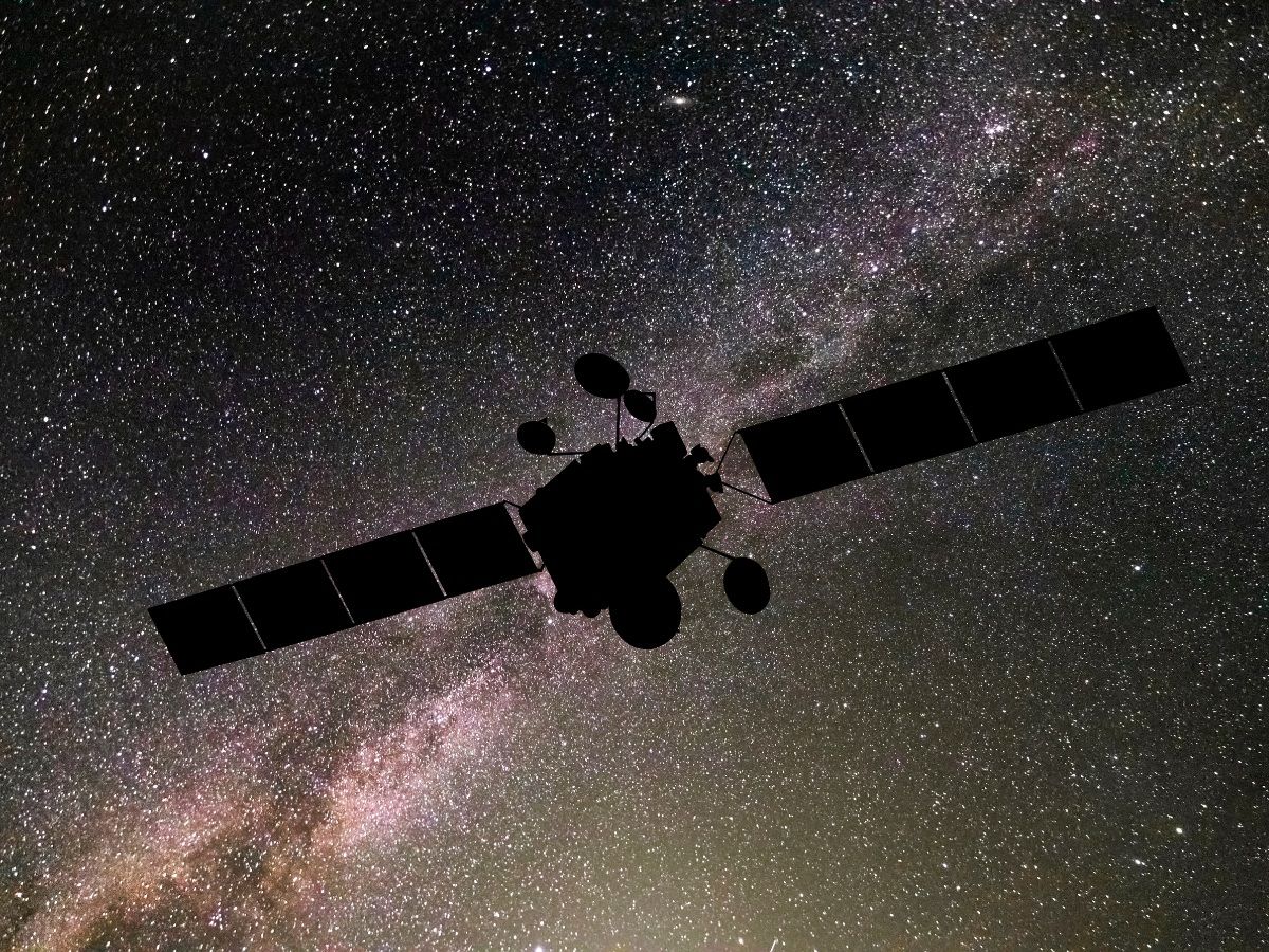 Communications satellite on the background of the starry sky. Satellite connection