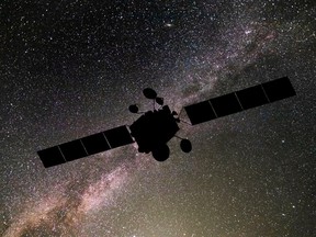 Communications satellite on the background of the starry sky. Satellite connection