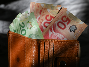A photo illustration featuring Canadian dollar banknotes, captured in Edmonton, Alberta, Canada, on February 4, 2025.