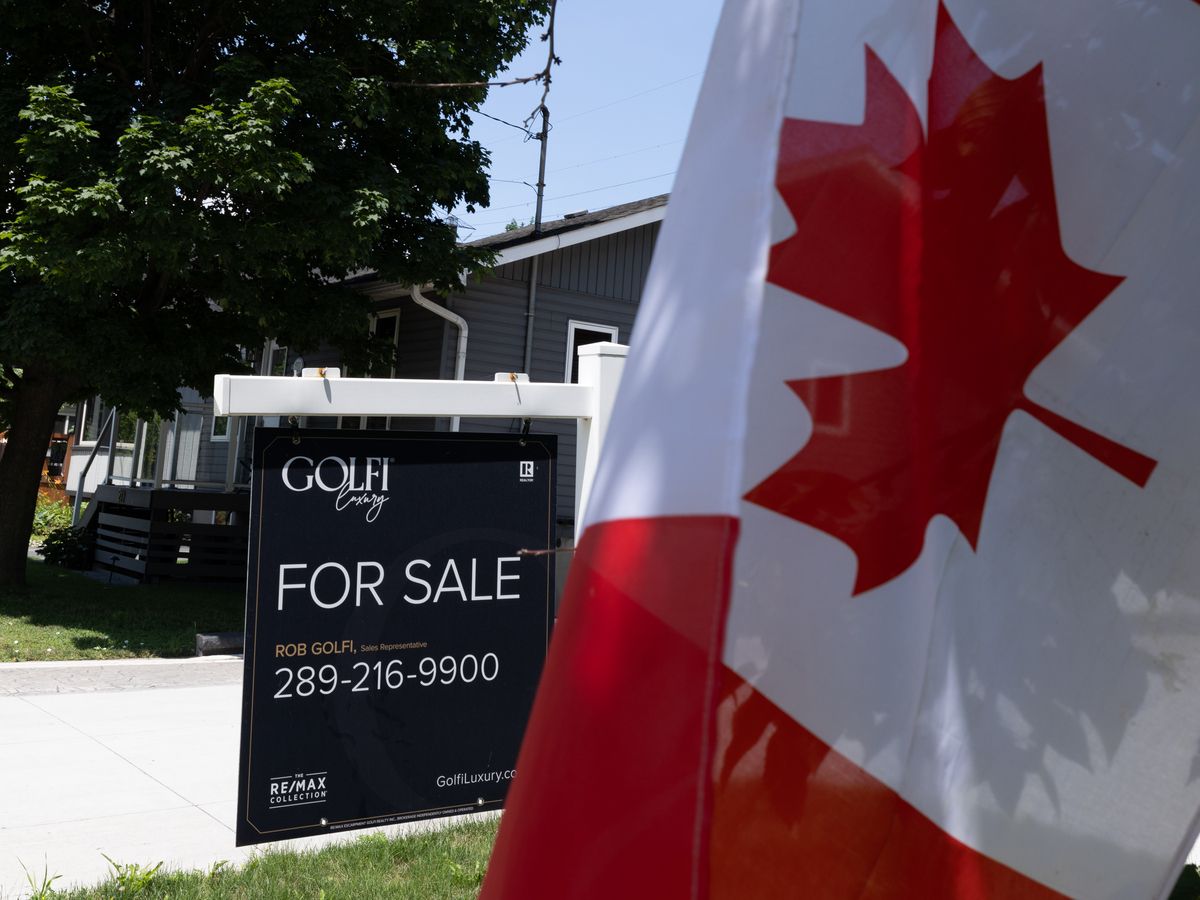 Real estate home for sale signage on Beach Boulevard in Hamilton, Ontario on Wednesday, July 8, 2026.