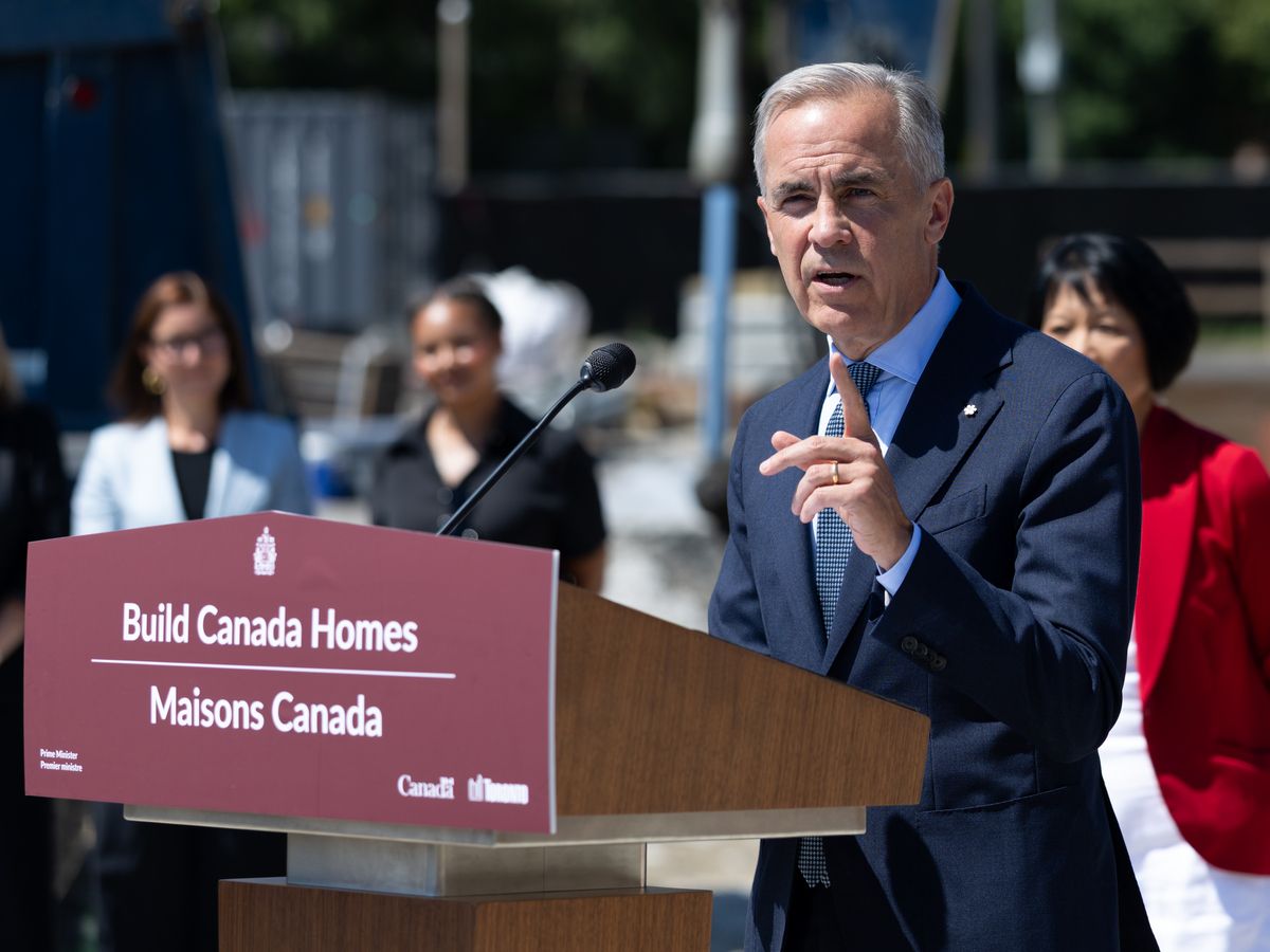 Prime Minister Mark Carney with Toronto Mayor Olivia Chow during a housing announcement at a construction site in Scarborough, Ontario on August 5, 2026.