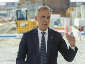 Canadian Prime Minister Mark Carney speaks to the media during a press conference at the Rio Tinto aluminum smelter in Saguenay Thursday August 6, 2026