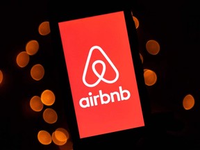 This illustration picture taken on November 22, 2019, shows the logo of the online lodging service Airbnb displayed on a smartphone in Paris.