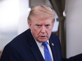 U.S. President Donald Trump speaks to reporters aboard Air Force One on August 02, 2026 on a return flight to Joint Base Andrews, Maryland.