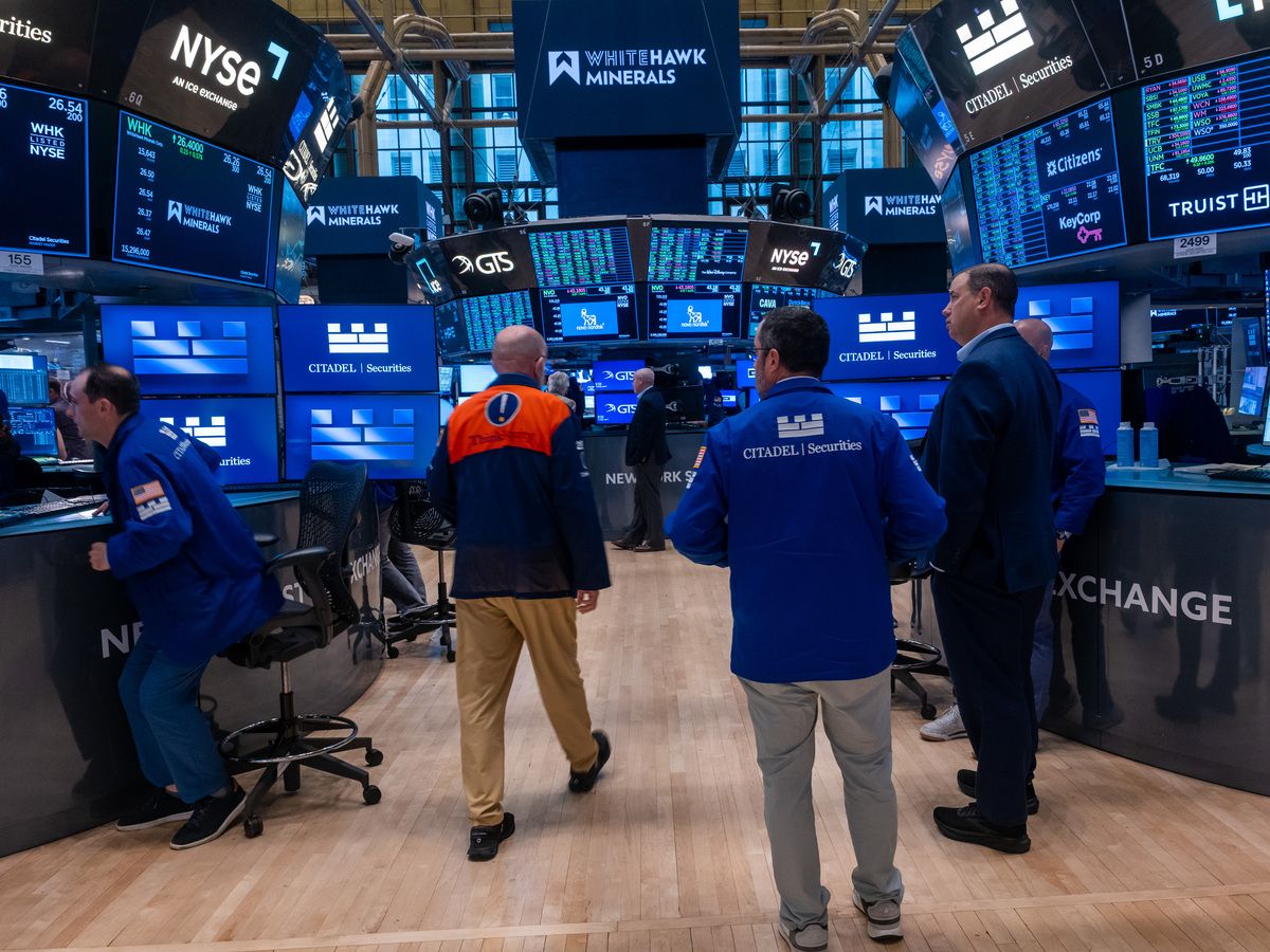 Traders work on the floor of the New York Stock Exchange (NYSE) the day after the Dow fell nearly 1,000 points as the conflict in Iran continues on June 11, 2026 in New York City.