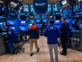 Traders work on the floor of the New York Stock Exchange (NYSE) the day after the Dow fell nearly 1,000 points as the conflict in Iran continues on June 11, 2026 in New York City.