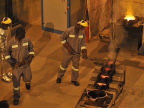 Workers work on a site of the Tongon gold mine operated by South African company on October 24, 2011 in Tongon, northern Ivory Coast.