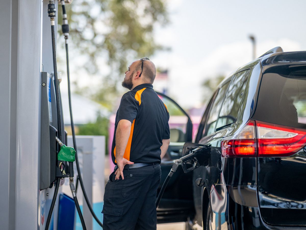 A person pumps gas at a Chevron gas station on August 07, 2026 in Austin, Texas.