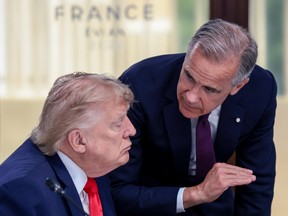 U.S. President Donald Trump speaks with Canadian Prime Minister Mark Carney at a working lunch with leaders of G7 and the Middle East, on June 16, 2026 in Evian-les-Bains, France. Leaders from the Group of 7 (G7) countries convened in Evian, France,