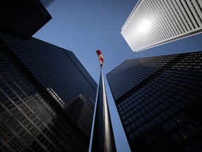 The Canadian flag flying between the TD Centre towers in the financial district in Toronto, Ontario on Tuesday, July 14, 2026.